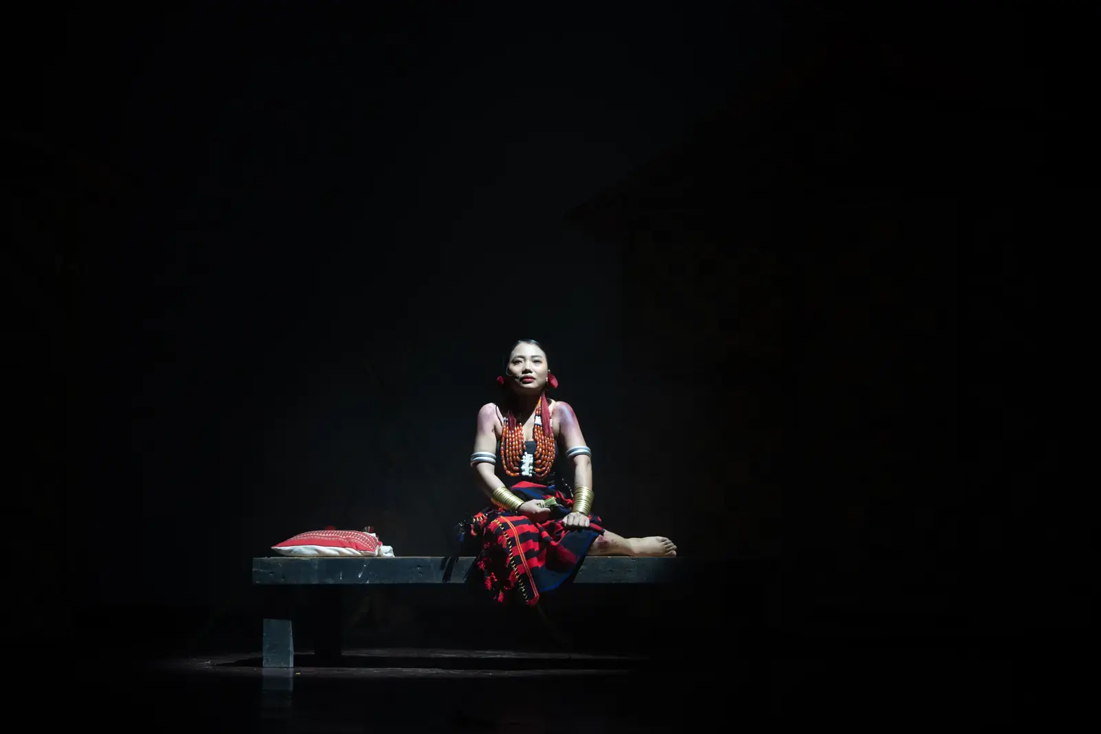 Village mourning chorus, candles held aloft, A Winter Night's Dream Kohima staging.