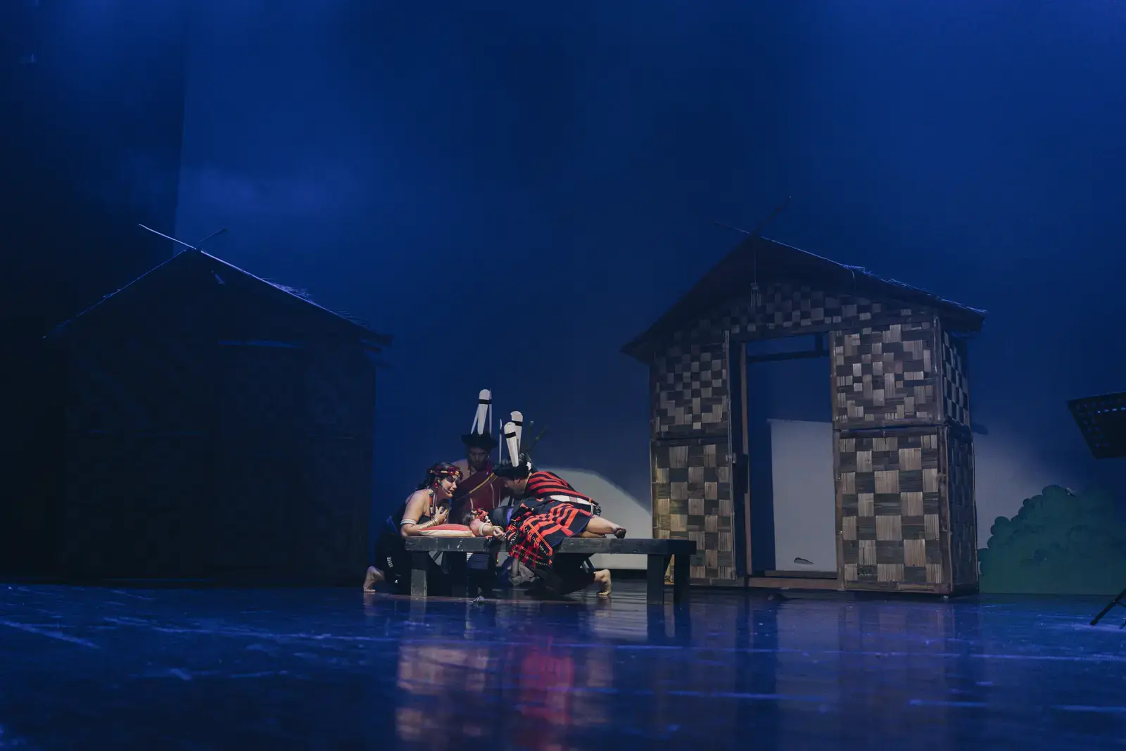 Lyrical reprise — Nisapa centre stage, ensemble kneeling, A Winter Night's Dream.